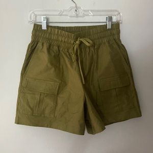 Small green Fabletics hiking/athletic shorts.
